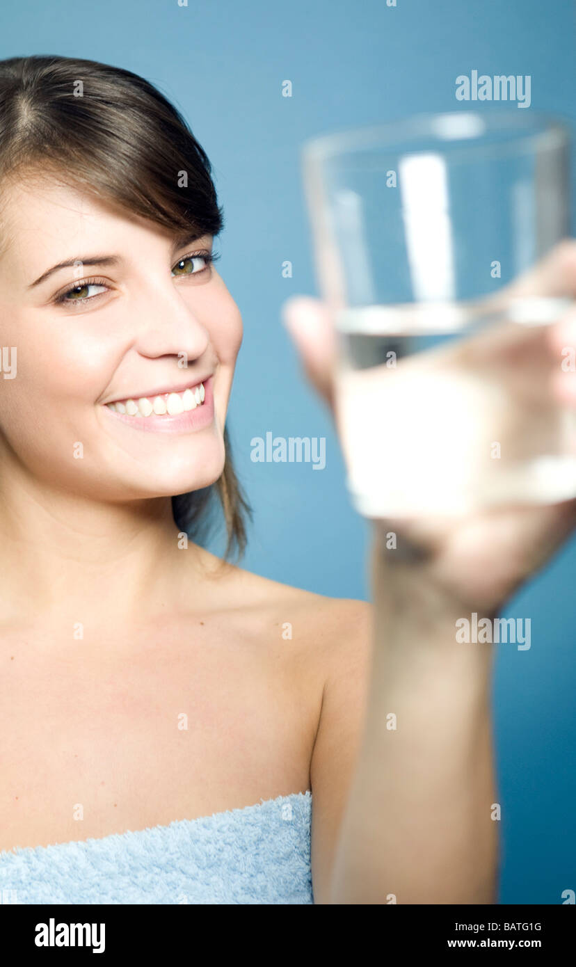 young woman holding a glass of water Stock Photo - Alamy
