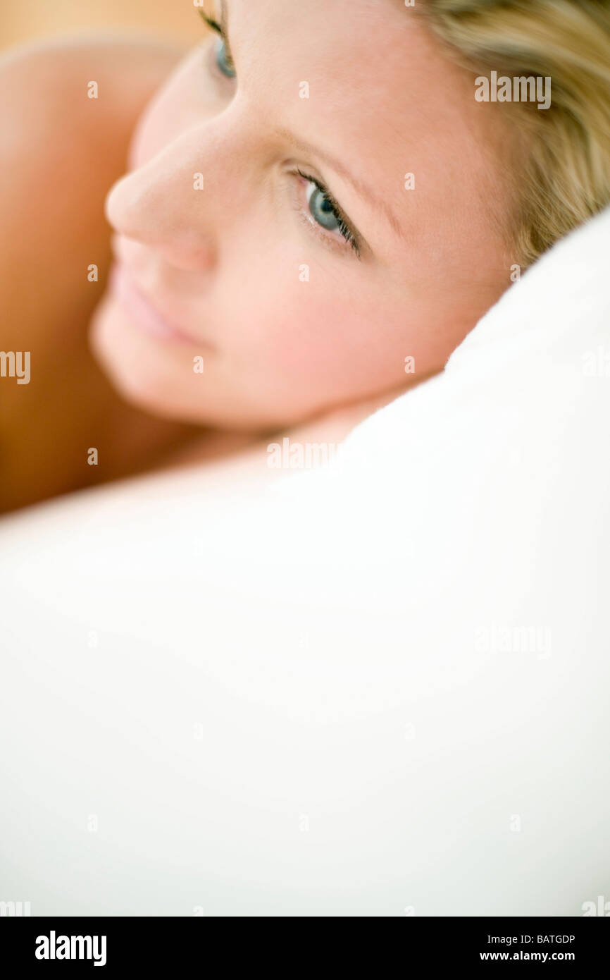 Young women with head on pillow Stock Photo Alamy