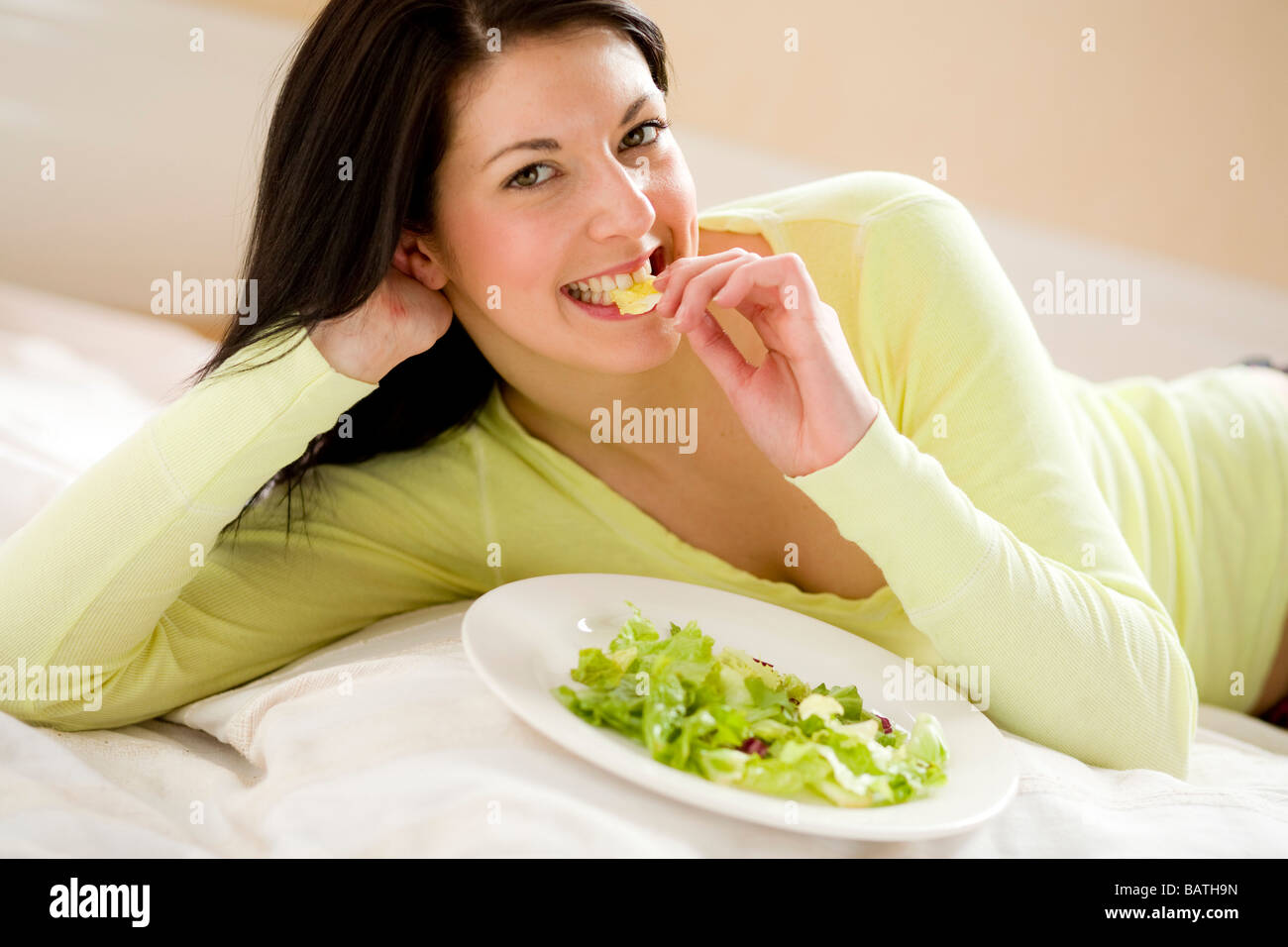 Girl eating salad Stock Photo