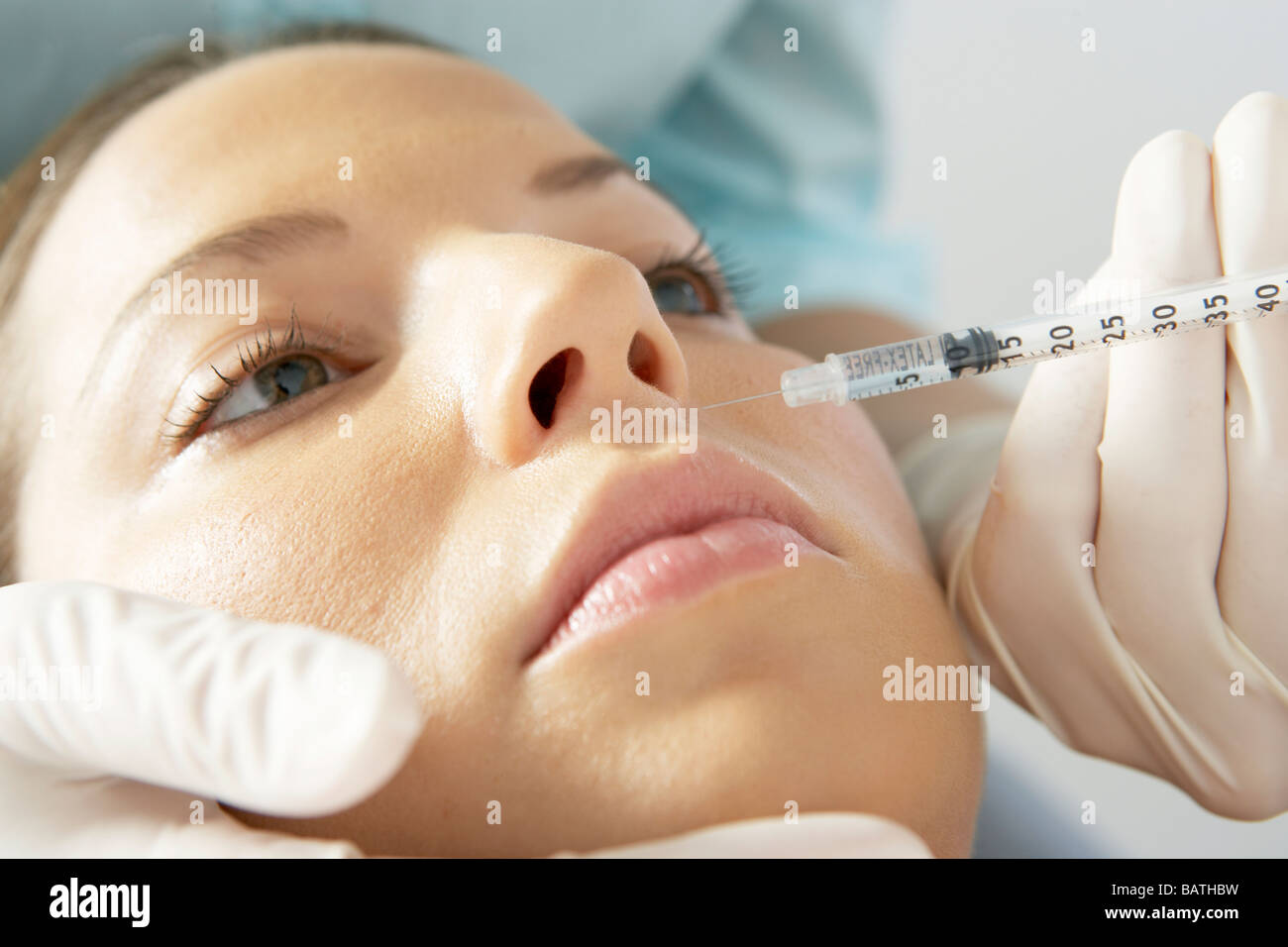 Botox treatment. Client having botox injected into her forehead Stock