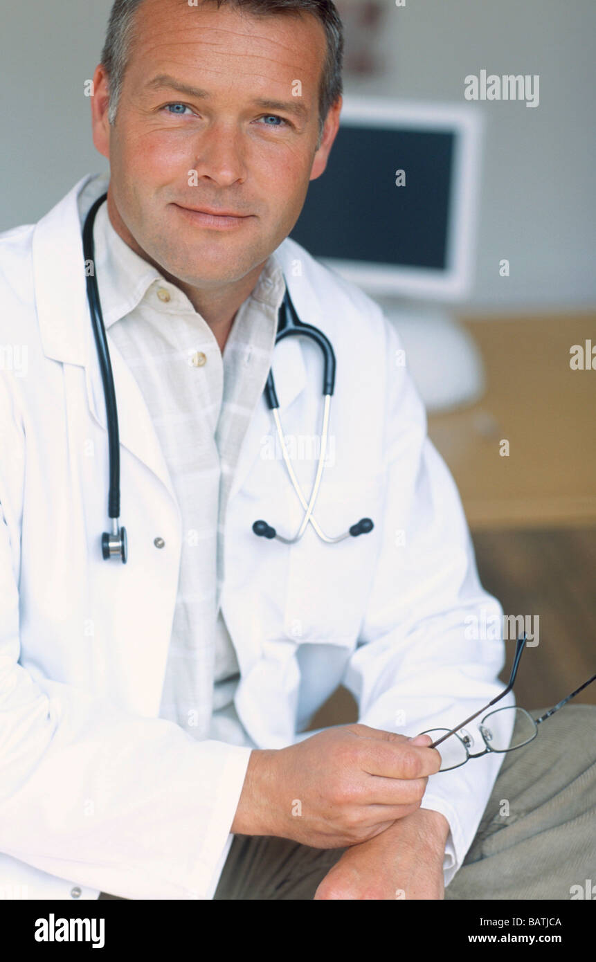 Man doctor stethoscope white coat hi-res stock photography and images ...