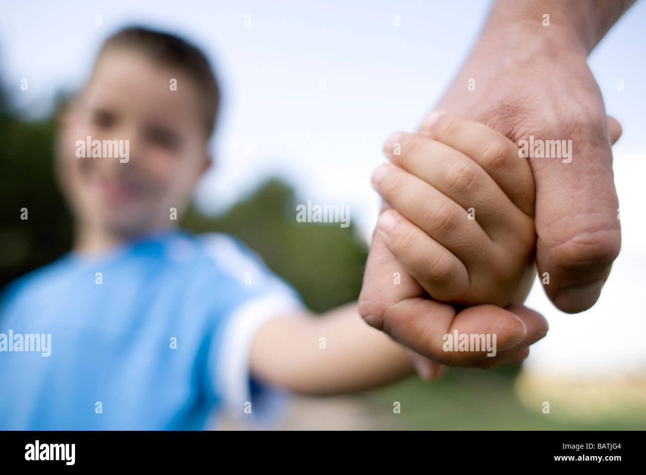 Father and son holding hands. Stock Photo