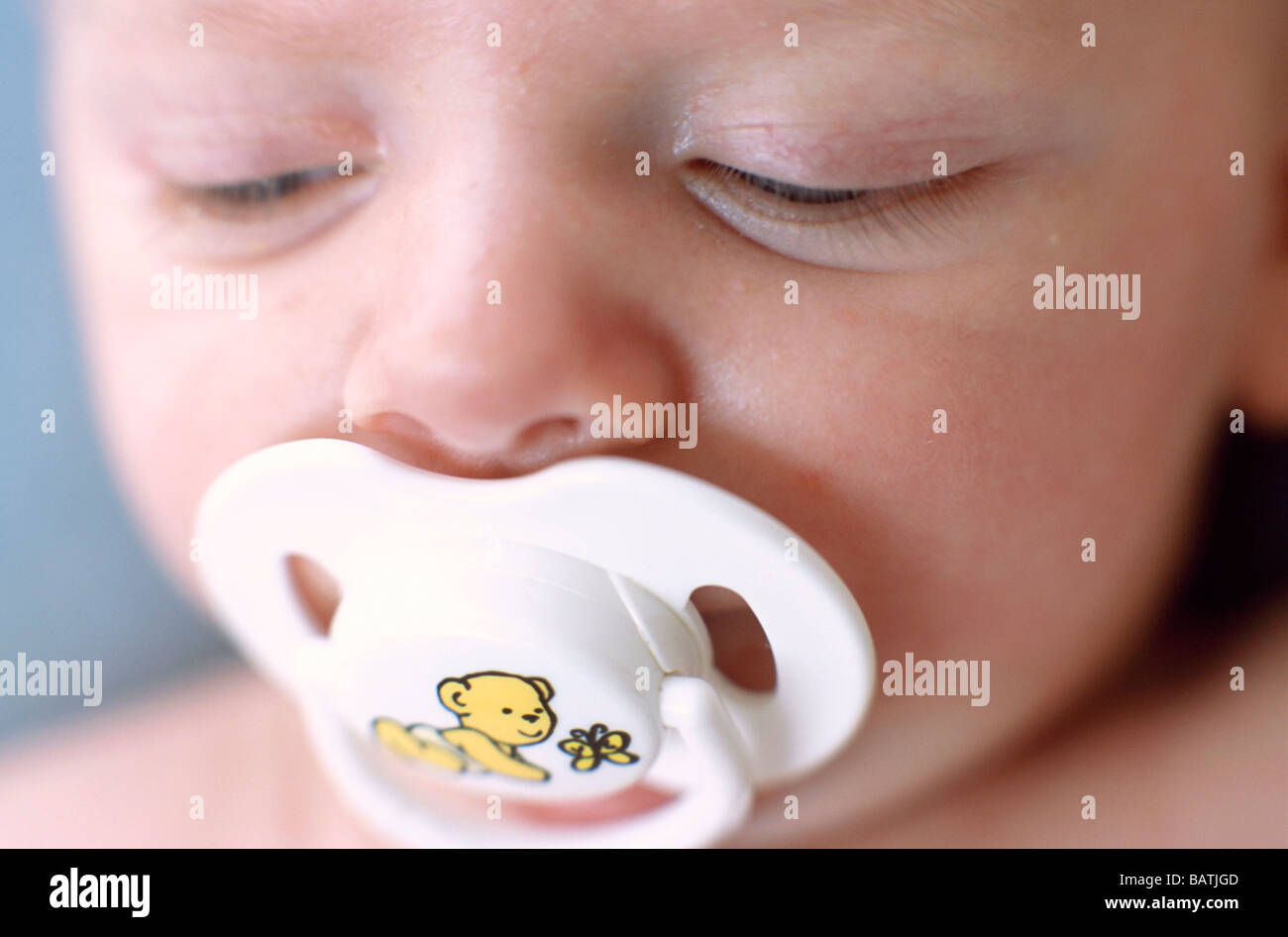 Boy sucking a pacifier hires stock photography and images Alamy
