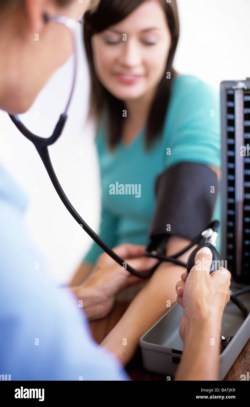 Blood pressure measurement. General practice doctor using