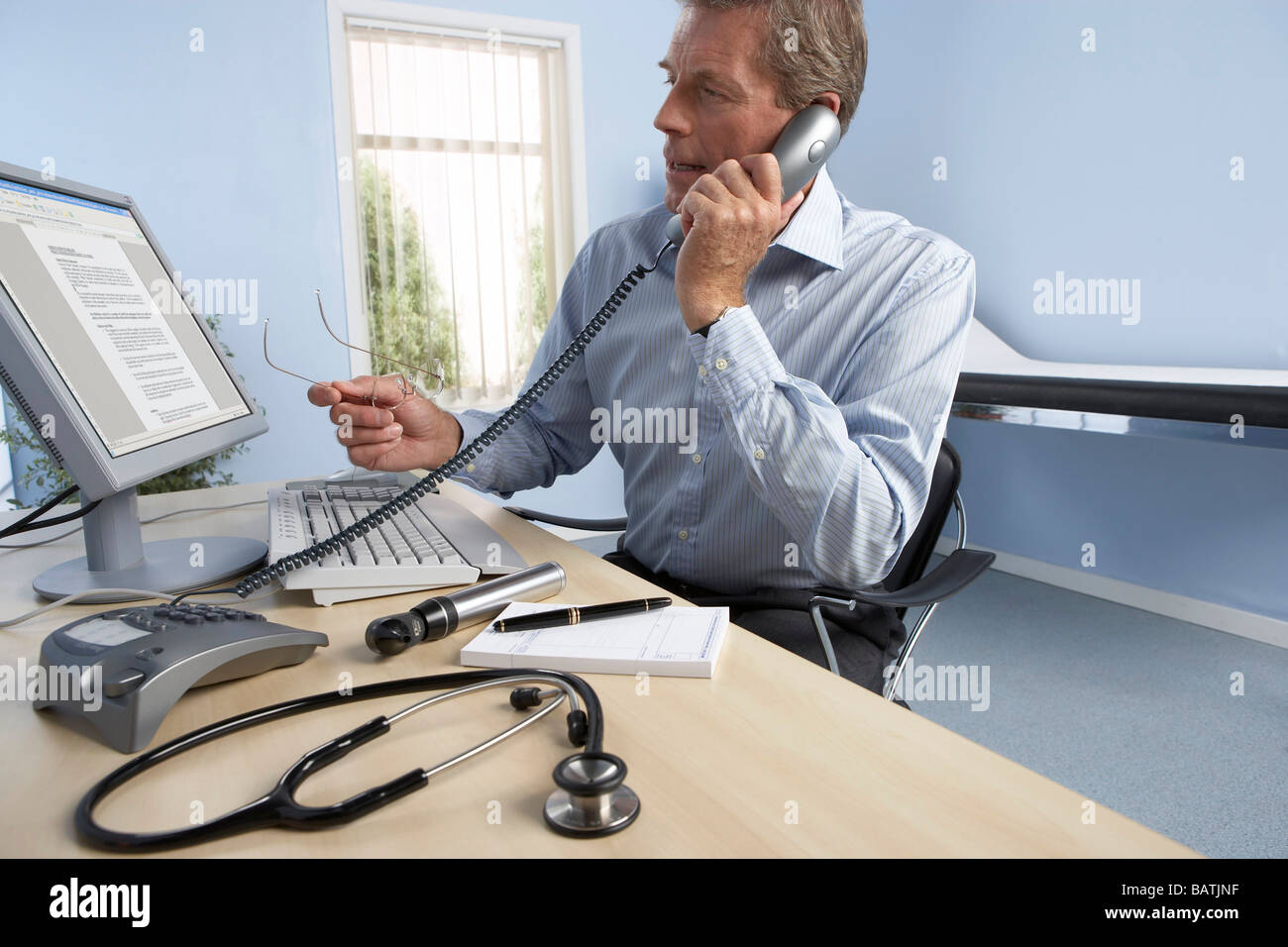 General practitioner at work in his office Stock Photo Alamy