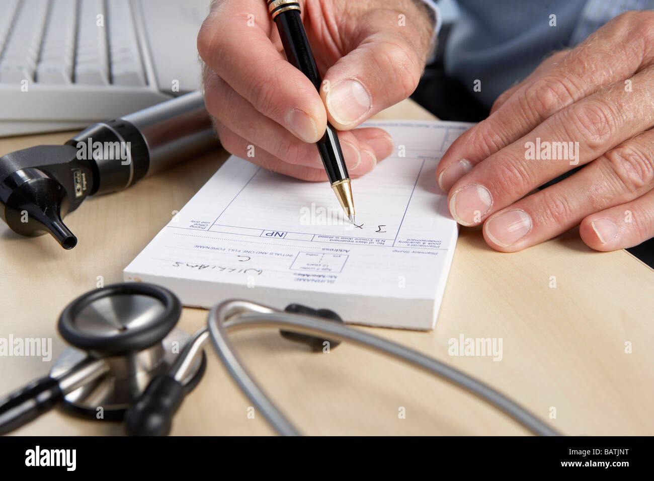 Prescription. General practice doctor writing a prescription Stock