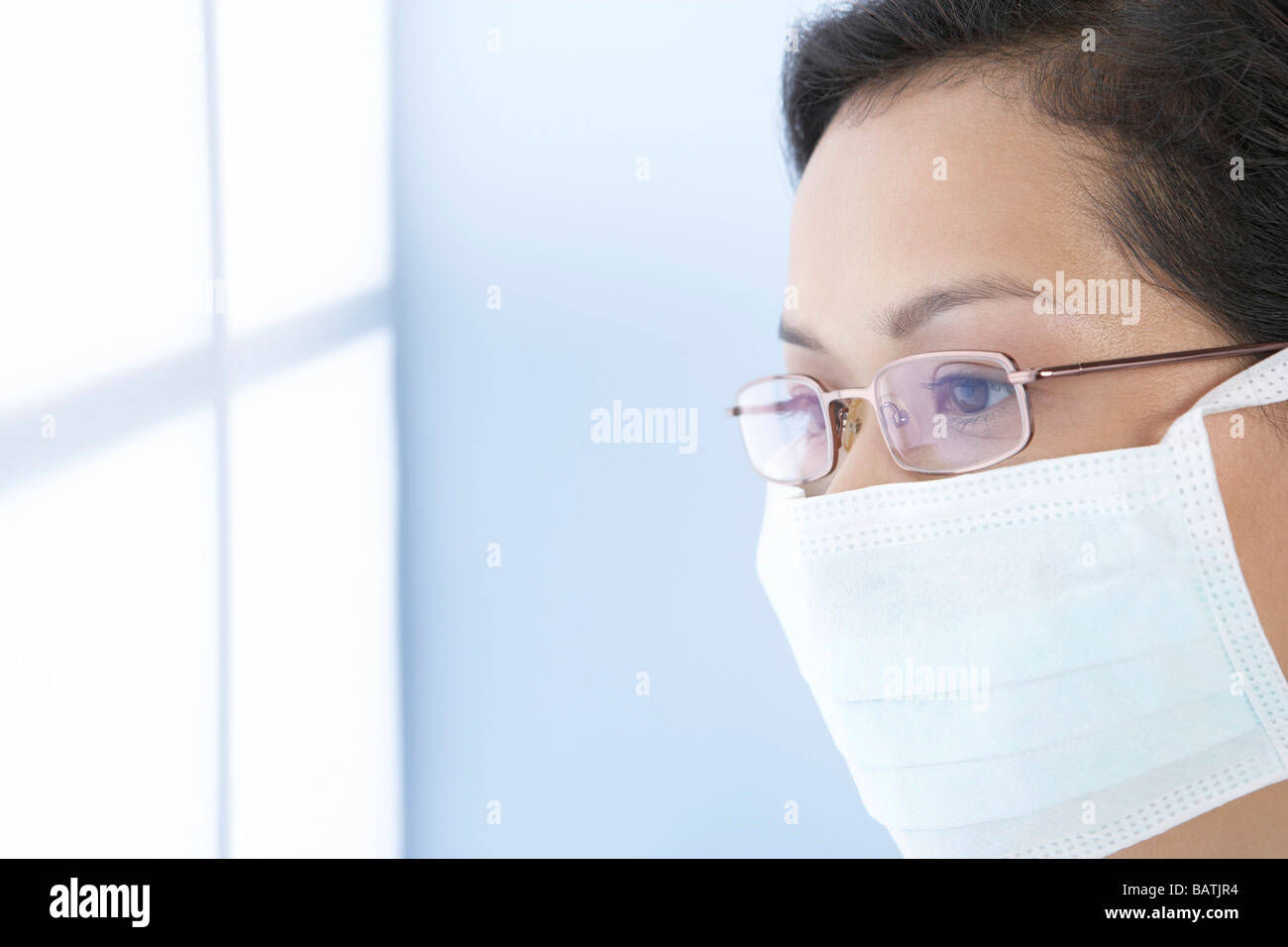 Surgical mask. Health professional wearing a surgical mask to protect