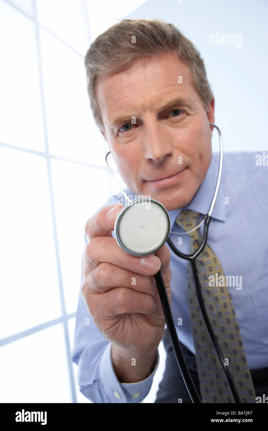 Doctor man holds stethoscope hi-res stock photography and images - Alamy