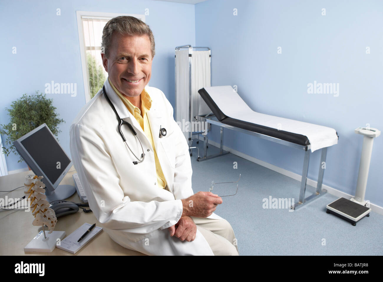 General practitioner in his office. Stock Photo