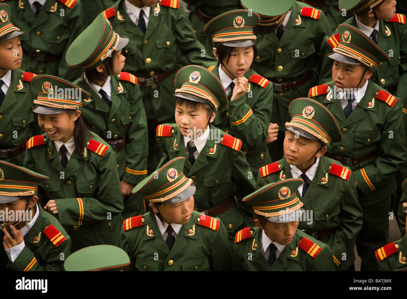 School children at the city sports stadium to rehearse for a parade in front of Party Leaders, Changchun Jilin Province China. Stock Photo