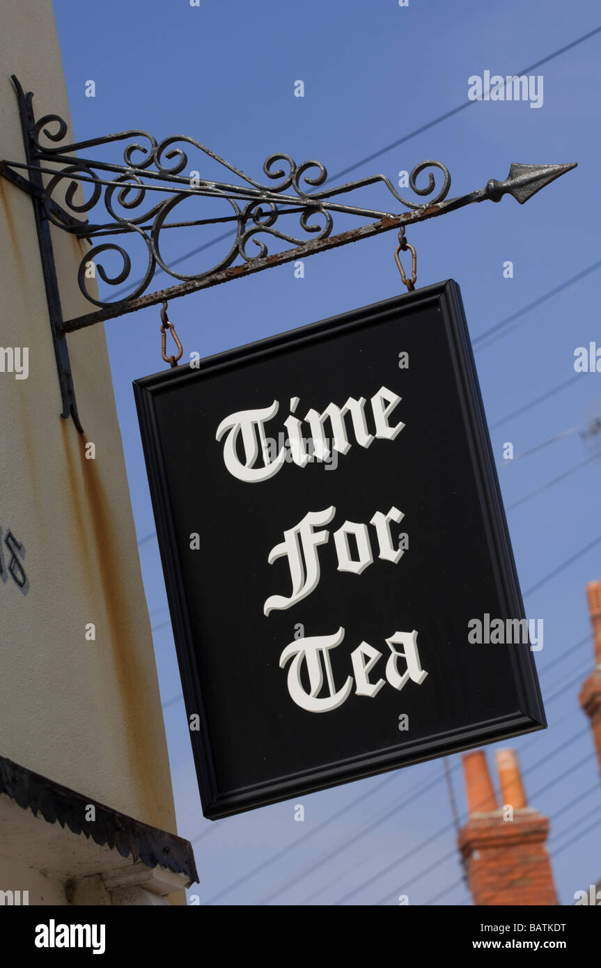 Shop sign reading “Time for Tea” hanging above a restaurant / café of that name near the waterfront at Weymouth Harbour, Dorset. Stock Photo