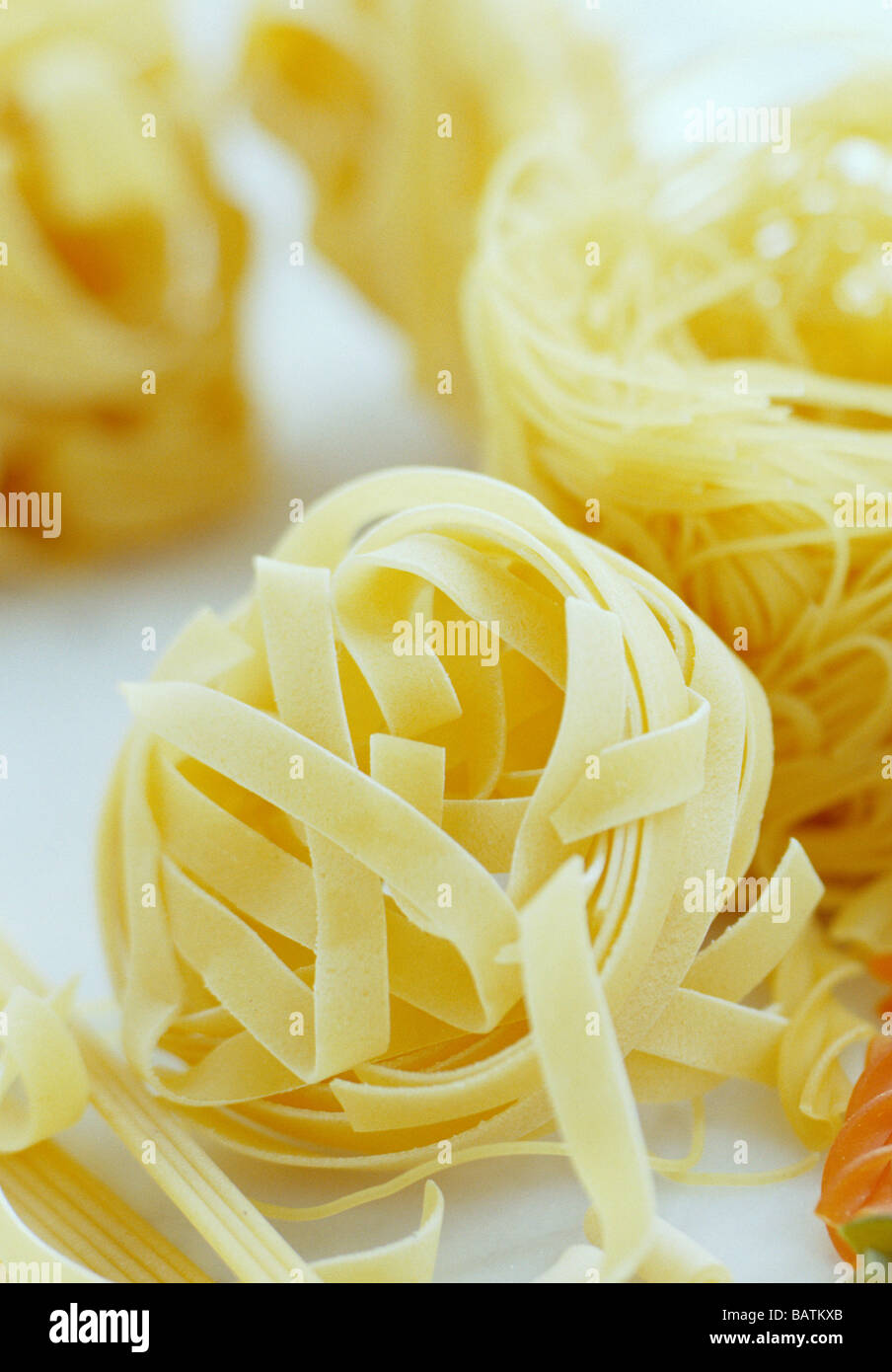 Dried pasta ribbons. Pasta is a flourbased food product, and so it contains lots
