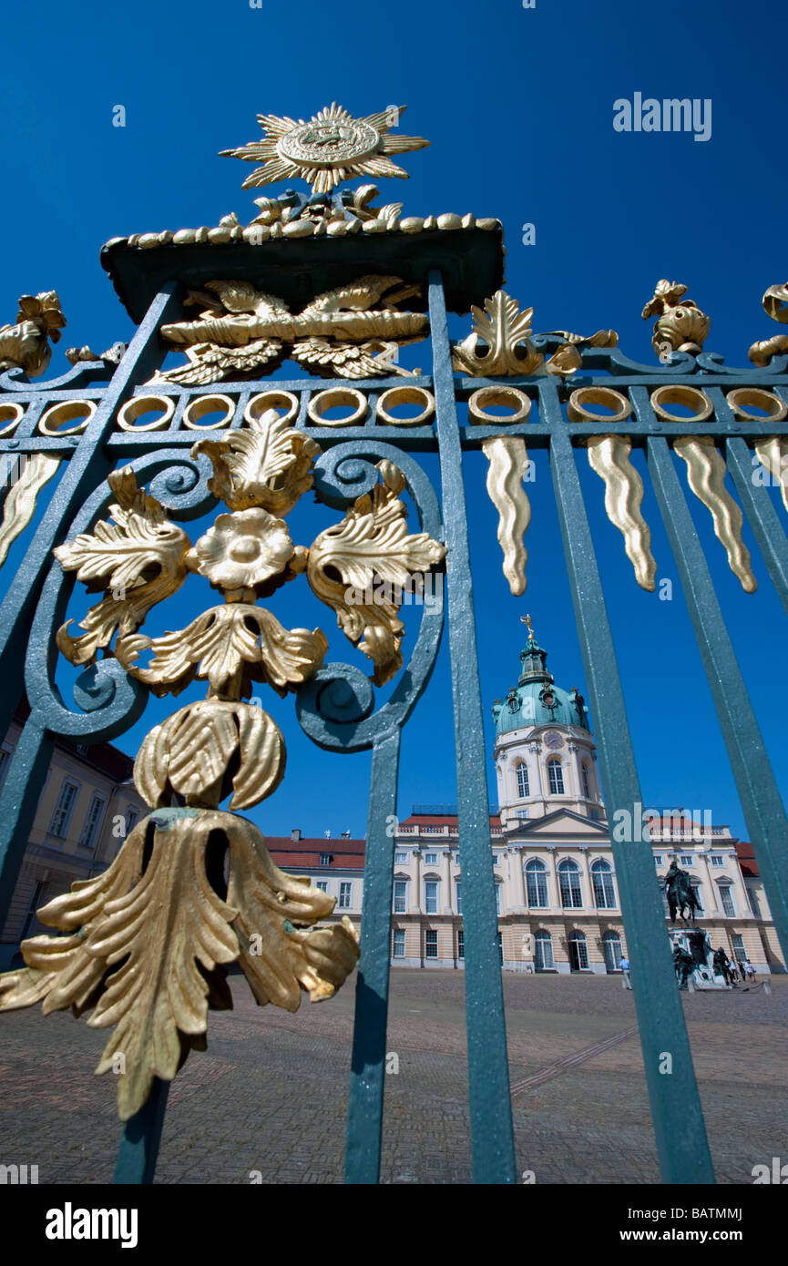 View of Schloss Charlottenburg palace through ornate gilded railings in Berlin Stock Photo