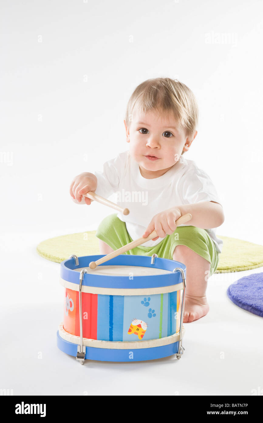 baby boy playing on drum Stock Photo Alamy