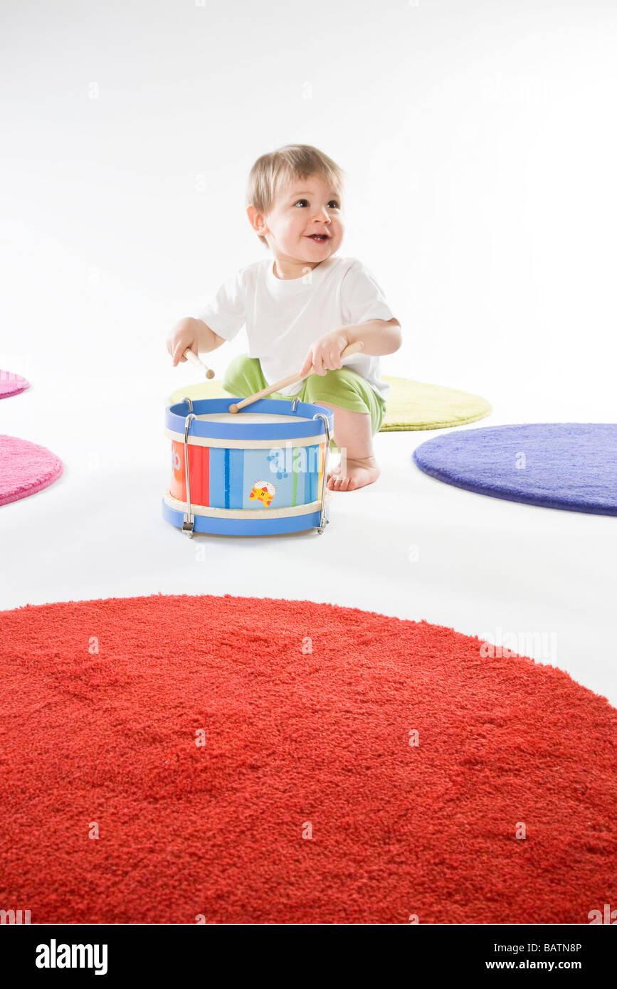 baby boy playing on drum Stock Photo Alamy
