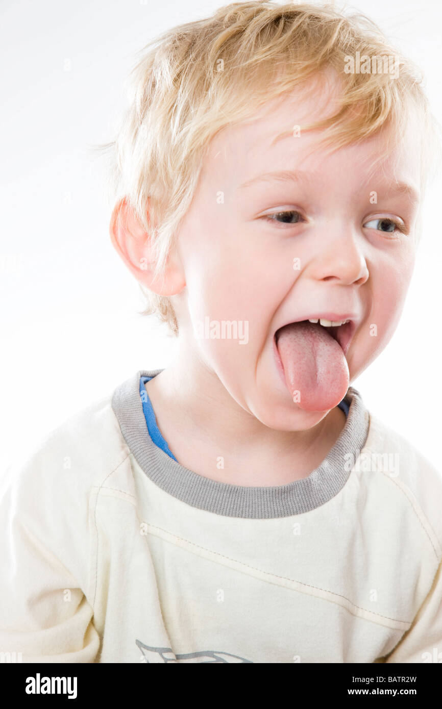 toddler boy showing tongue Stock Photo