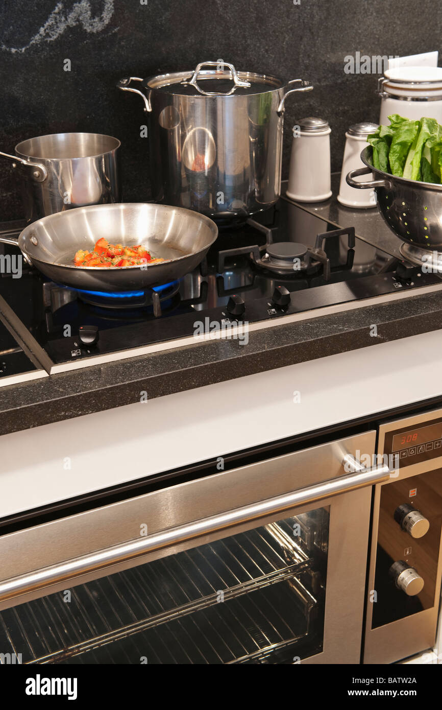 Vegetables in frying pan on cooker Stock Photo Alamy