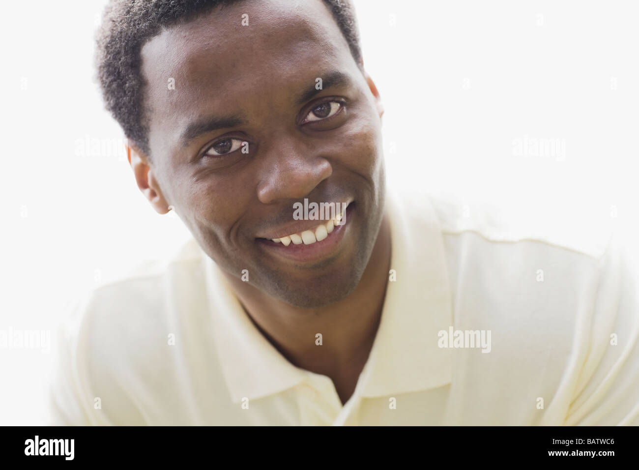 Studio portrait of man smiling Stock Photo - Alamy