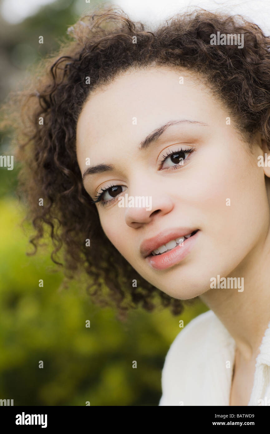 Portrait of young woman smiling, outdoors Stock Photo - Alamy