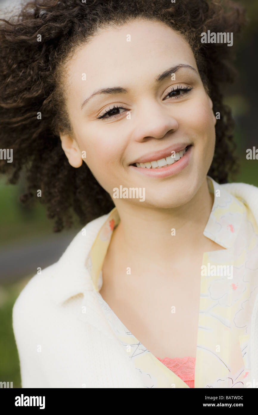 Portrait of young woman smiling, outdoors Stock Photo - Alamy