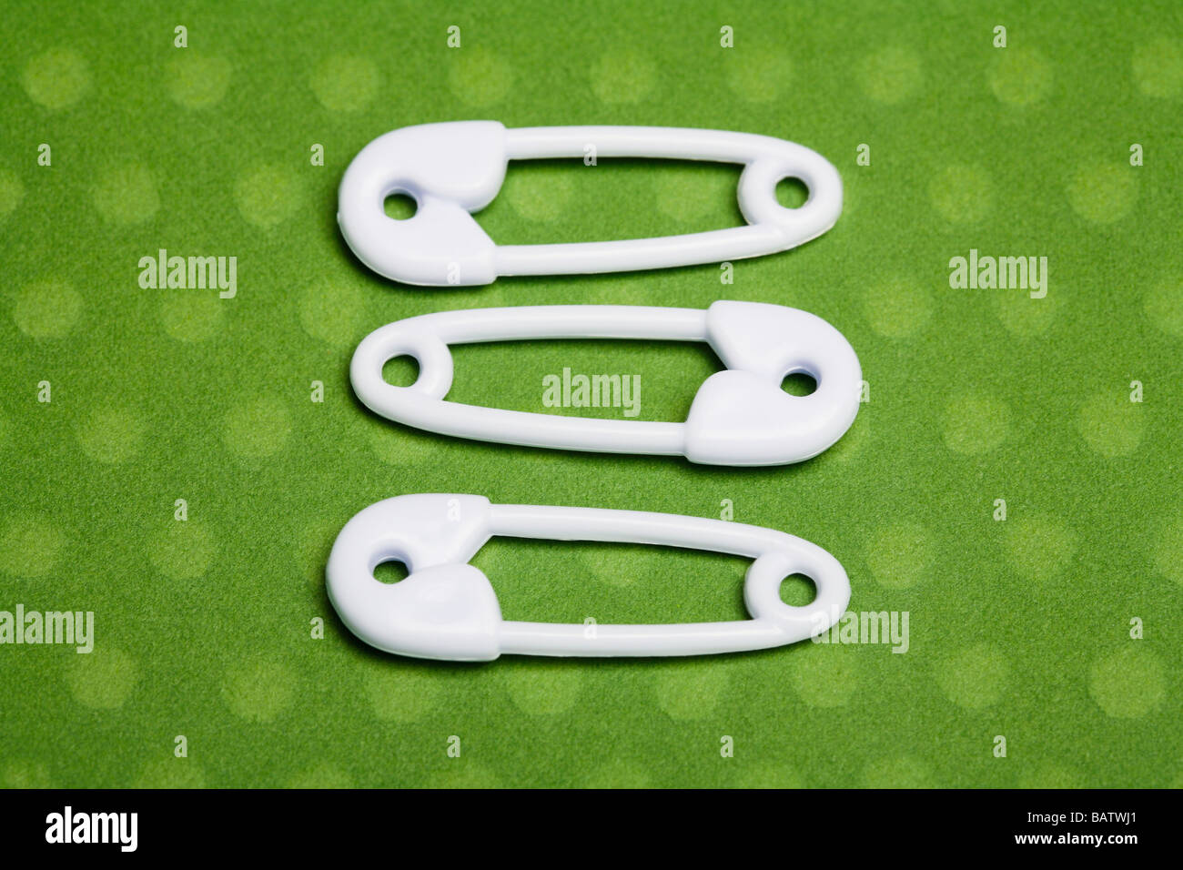 Three safety pins Stock Photo Alamy