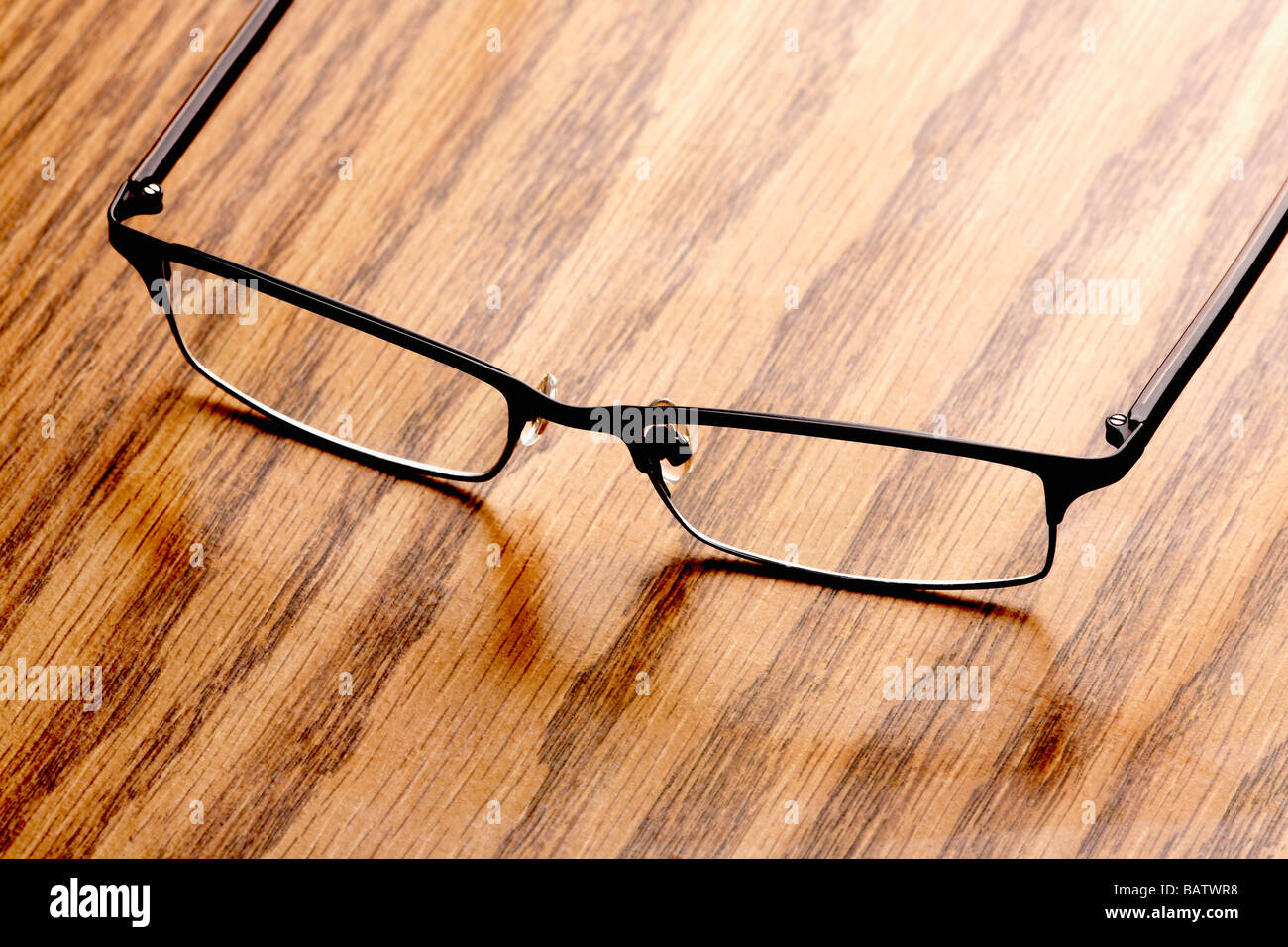 Eyeglasses on wood grain Stock Photo