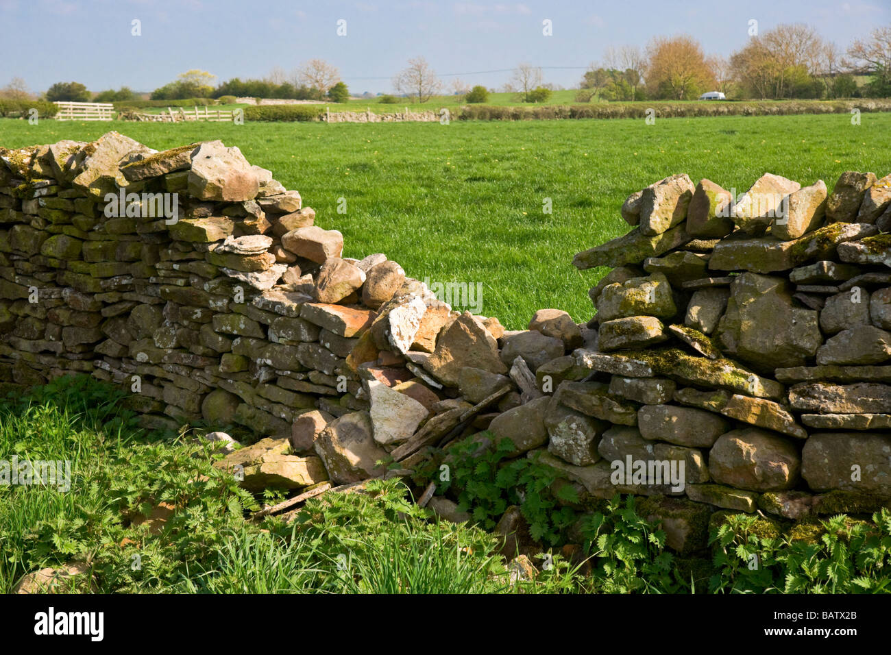 Dry stone wall in need of repair Stock Photo