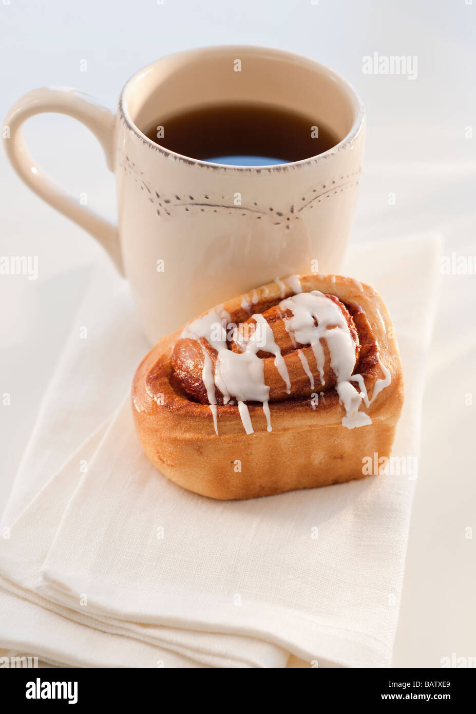 cinnamon bun with coffee Stock Photo Alamy