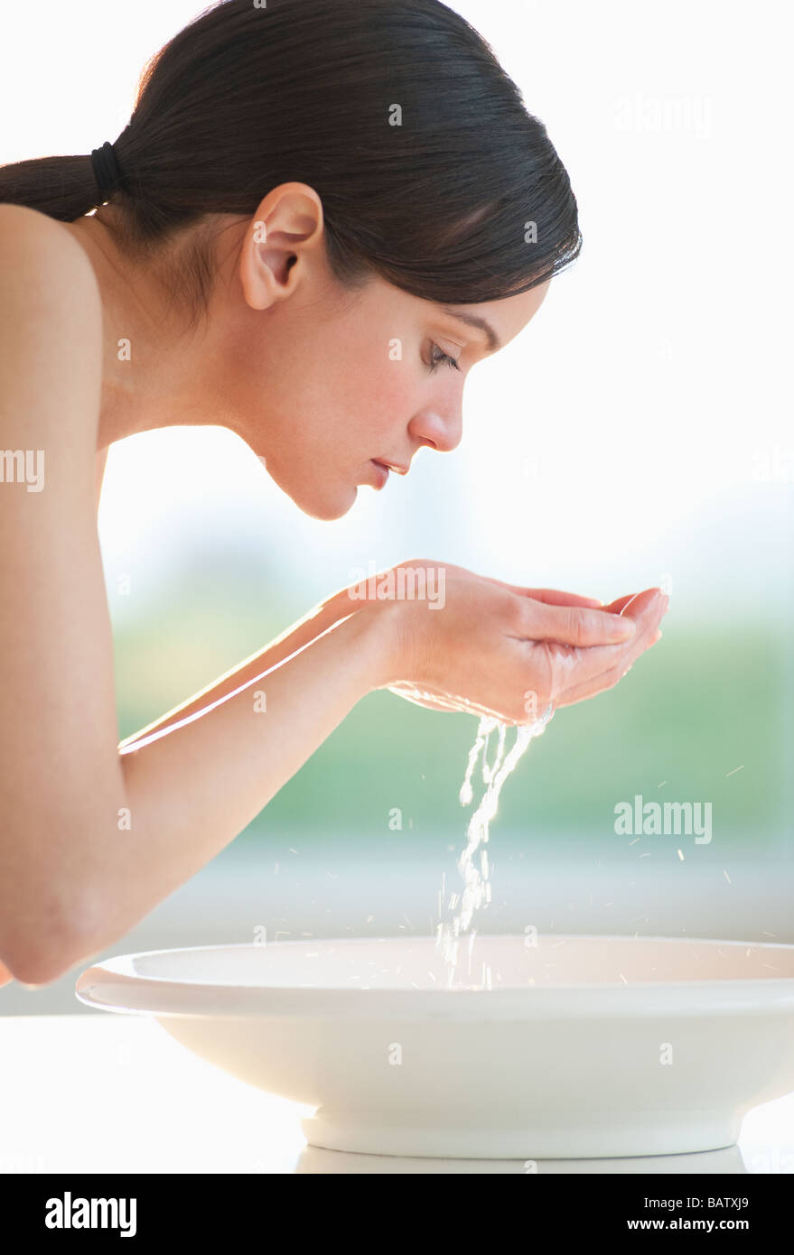 Woman washing her face hires stock photography and images Alamy
