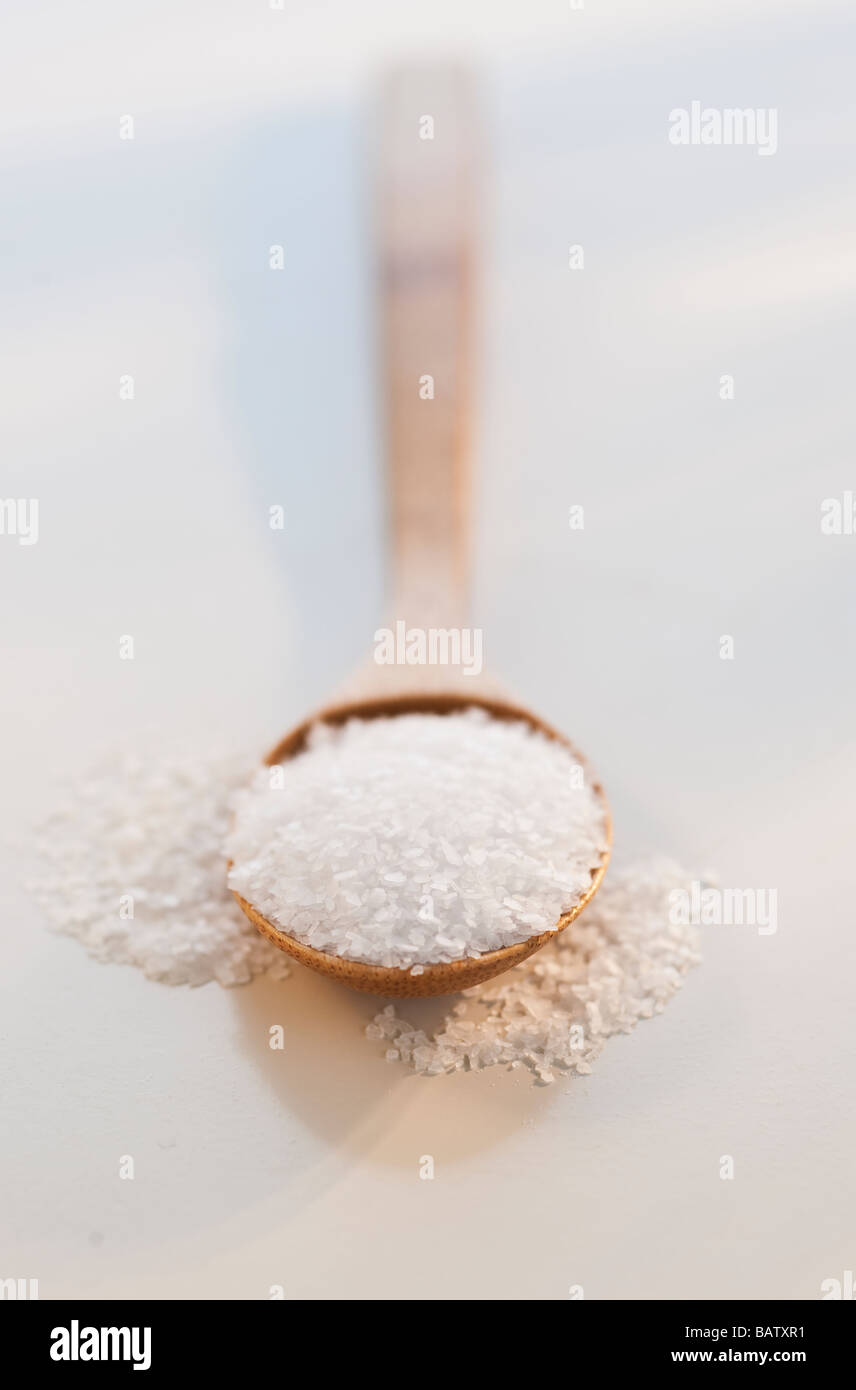 Wooden spoon of salt, studio shot Stock Photo