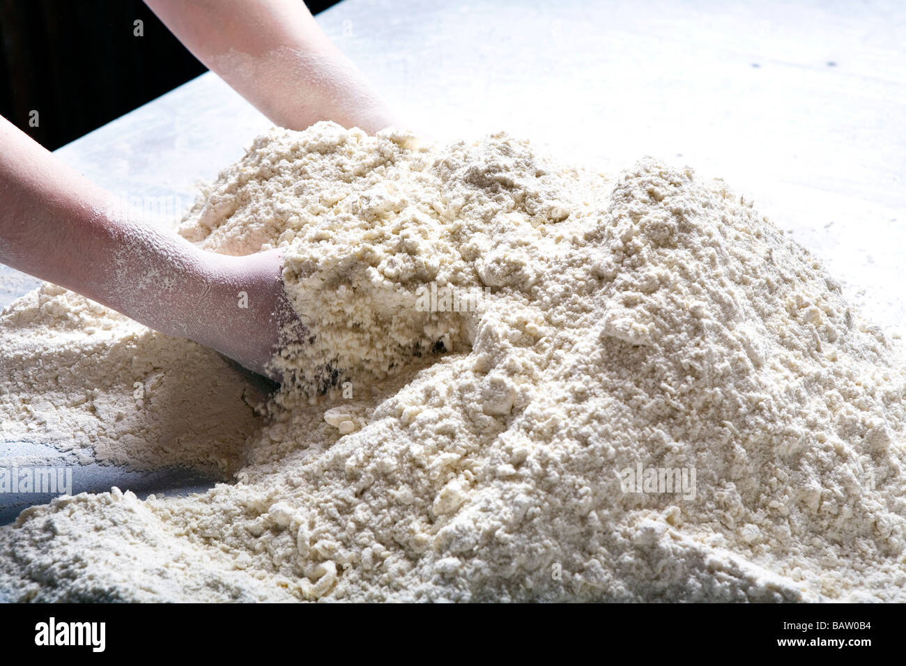detail of baker mixing dough Stock Photo Alamy
