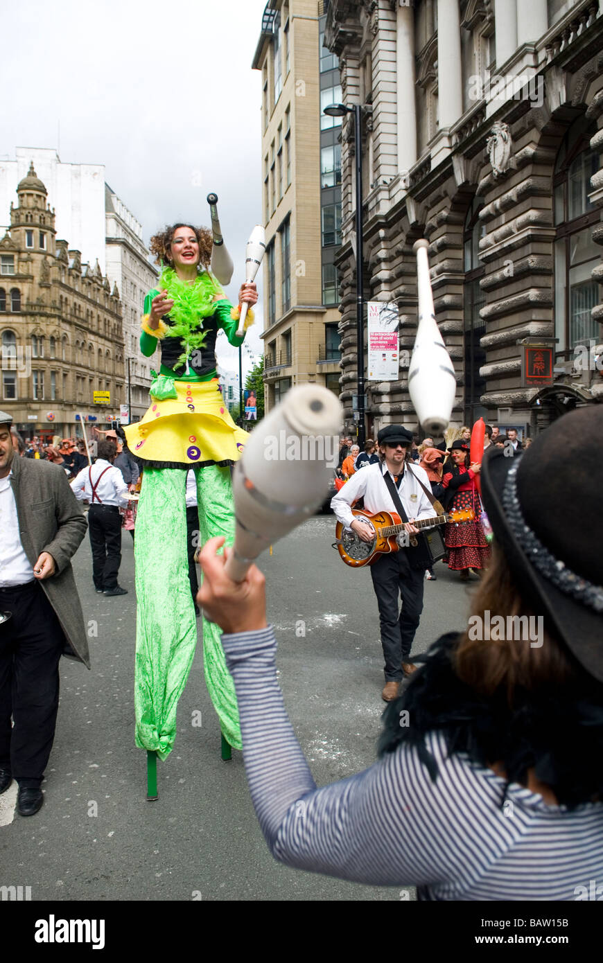 Jugglers on stilts during the Spanish festival in Manchester UK Stock