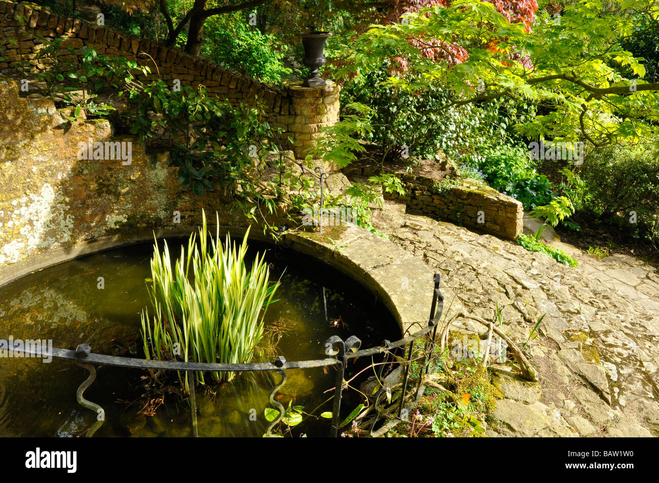 Kiftsgate Court Garden, Gloucestershire, England - The Round Pool and steps in the 'Middle Bank'. Stock Photo