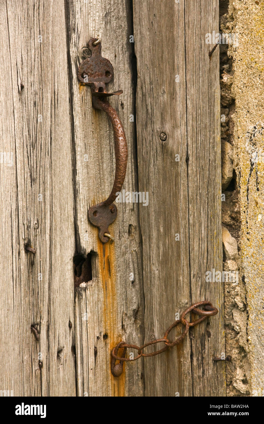 Old door latch and chain Stock Photo