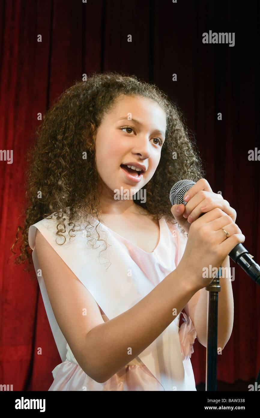 Mixed race girl competing in beauty pageant Stock Photo
