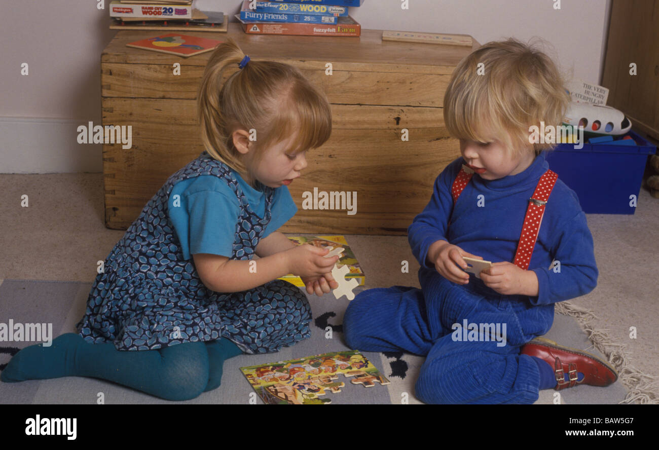 children doing a jigsaw puzzle together Stock Photo Alamy