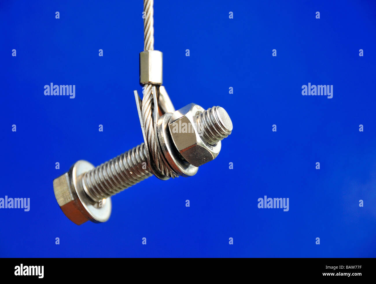 Steel bolt on a blue background Stock Photo