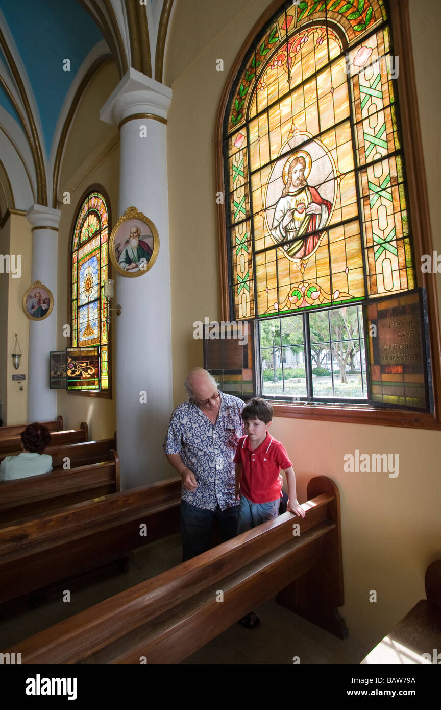 Grandfather and grandson at Nuestra Señora de la Guadalupe Cathedral (AKA Ponce Cathedral) located in Ponce, Puerto Rico. Stock Photo