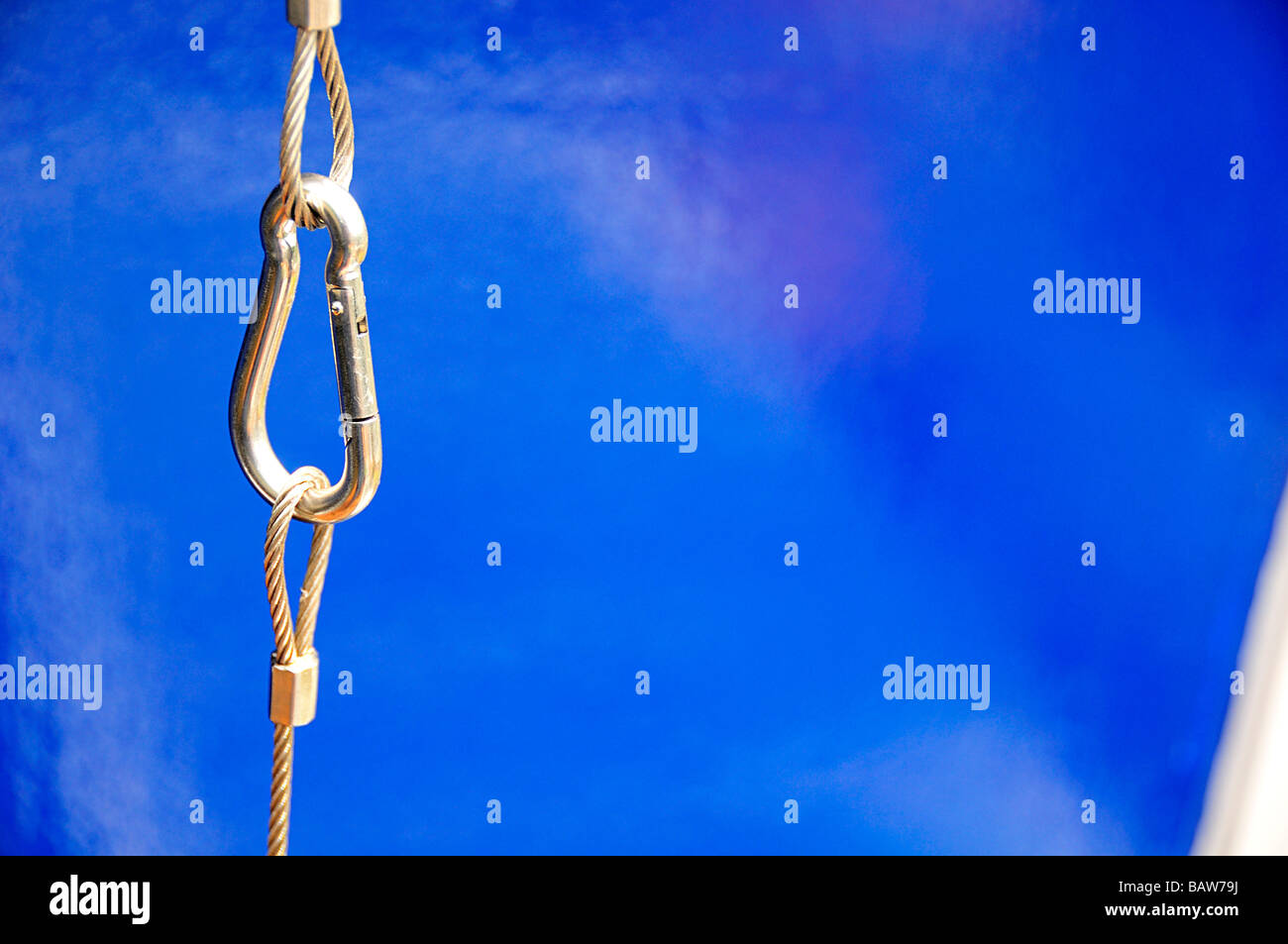 Cable and clip on a blue background Stock Photo - Alamy