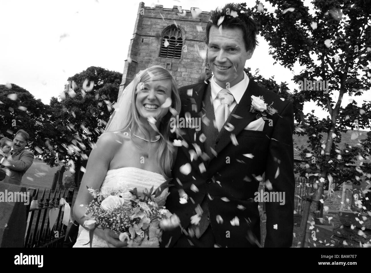 Young couple of newly weds just married at the church, North Yorkshire. UK MODEL RELEASED black & white image Stock Photo
