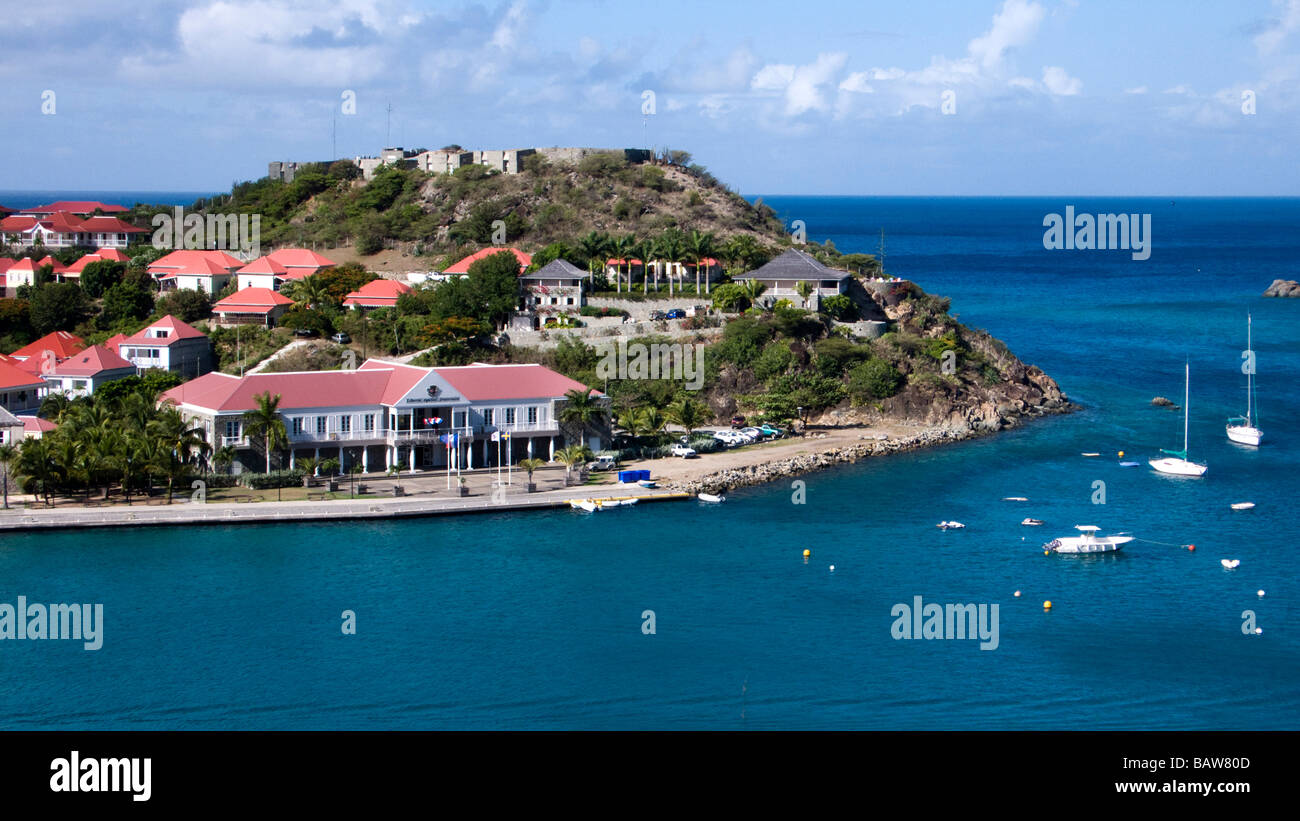 Fort Oscar overlooks red tin roof buildings at entrance to Gustavia port St Barts Stock Photo