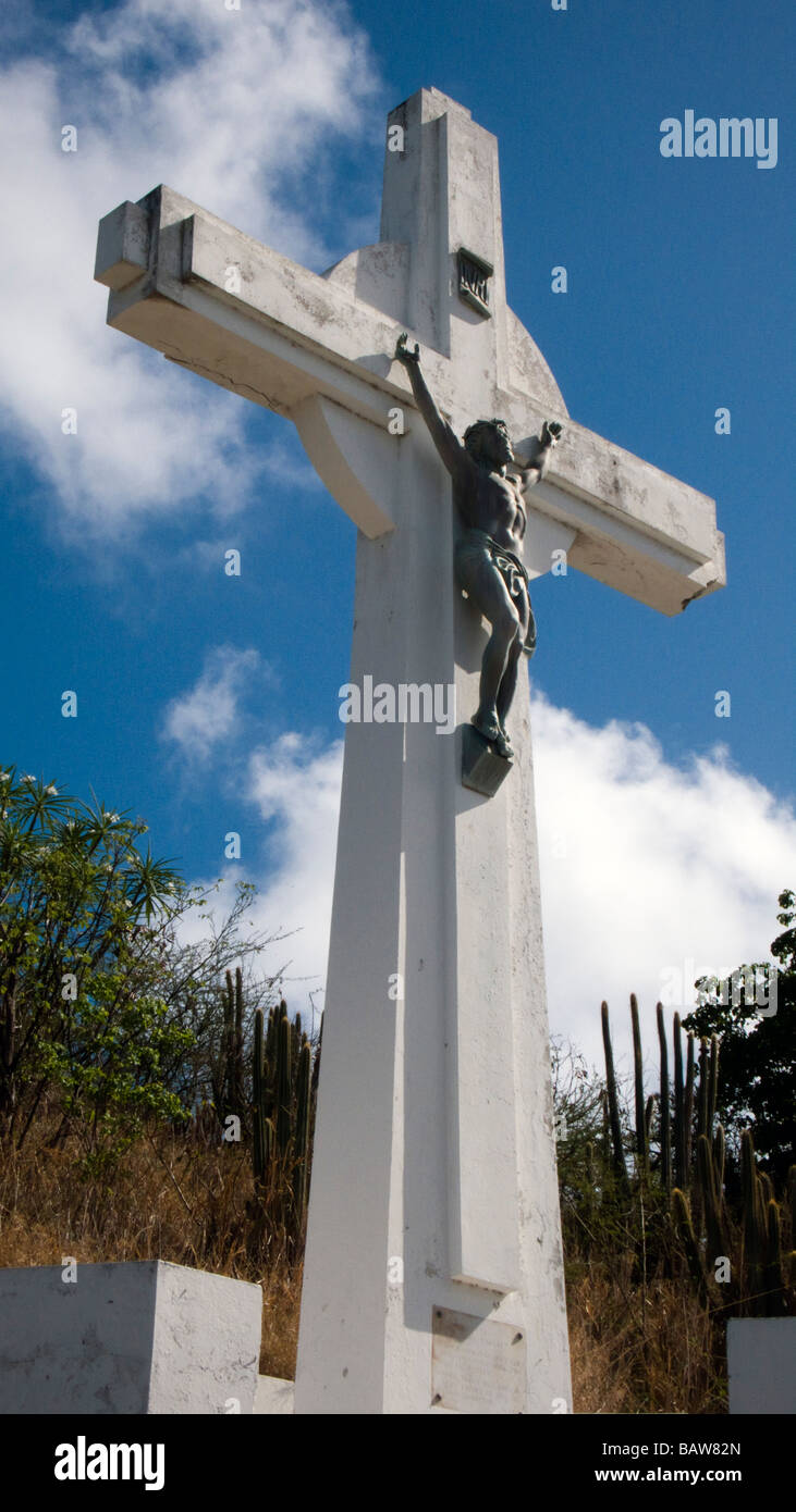 White Le calvaire cross depicting crucifixion on road below Fort Gustave St Barts Stock Photo