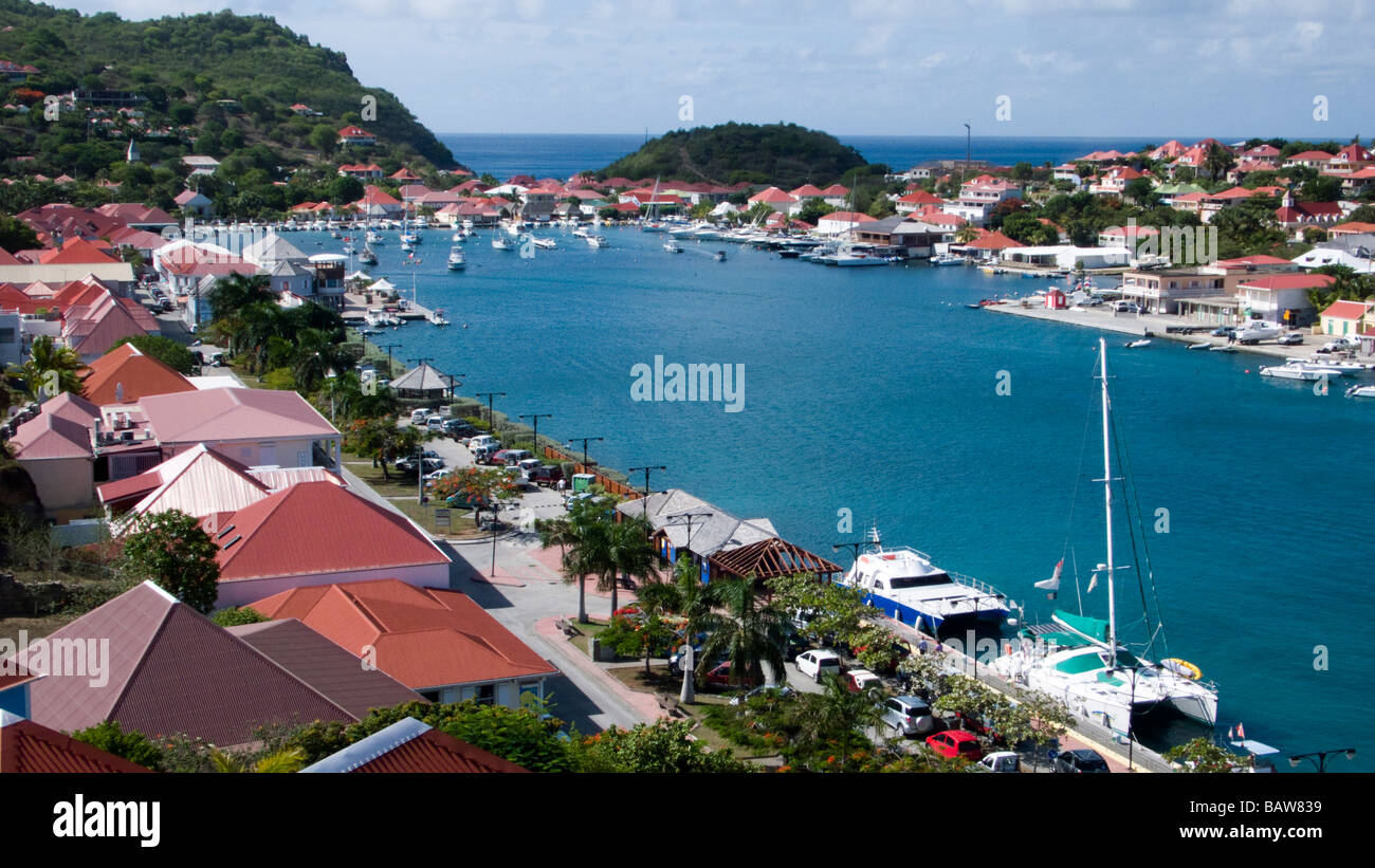 Red tin roof buildings surround Gustavia port St Barts Stock Photo