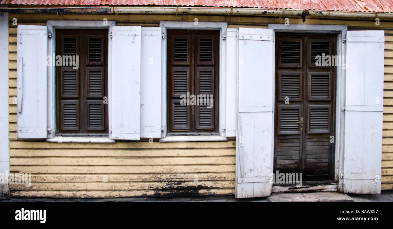 Weather beaten wooden home with louvers and shutters Gustavia St Barts Stock Photo