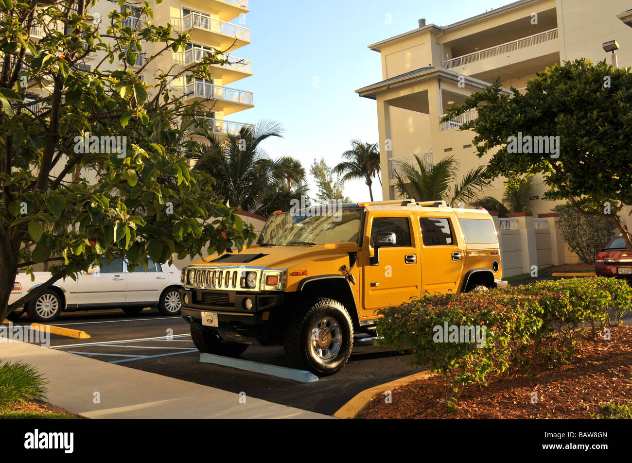 Hummer SUV parked in front of luxury condo. Stock Photo