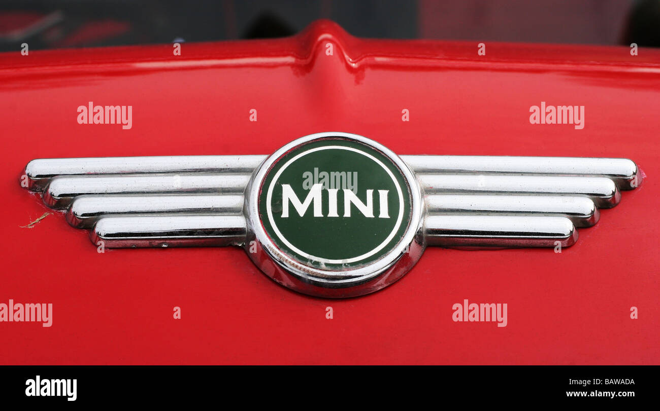 Classic British racing green Mini cooper badge/logo on red bonnet bodywork Stock Photo