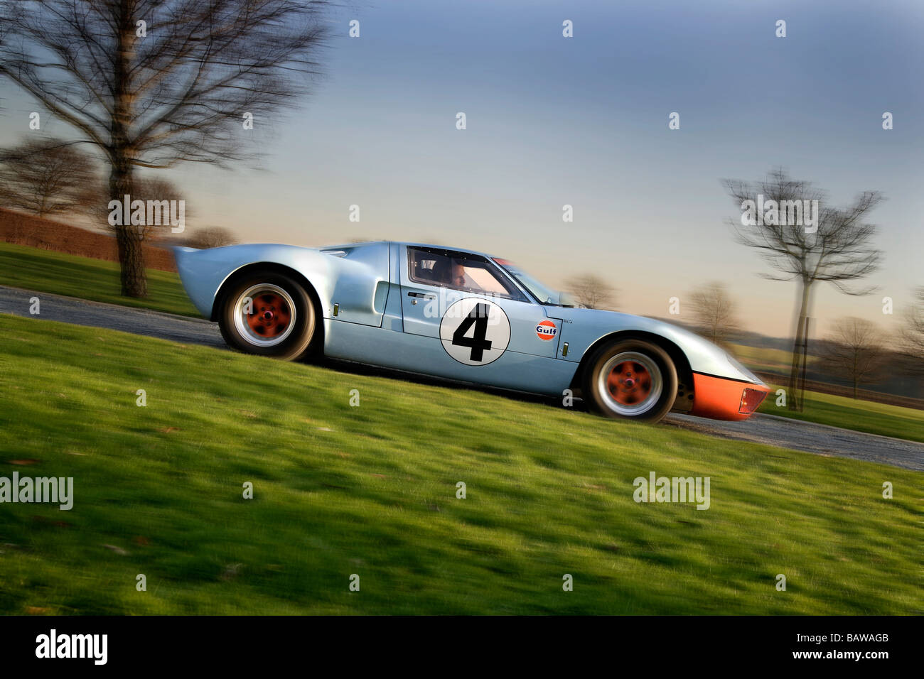 Ford gt40 in panning profile.blue and orange livery with the number 4 decals Stock Photo