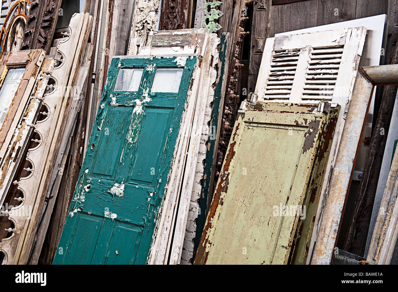 Reclaimed shutters and doors at a salvage yard Stock Photo