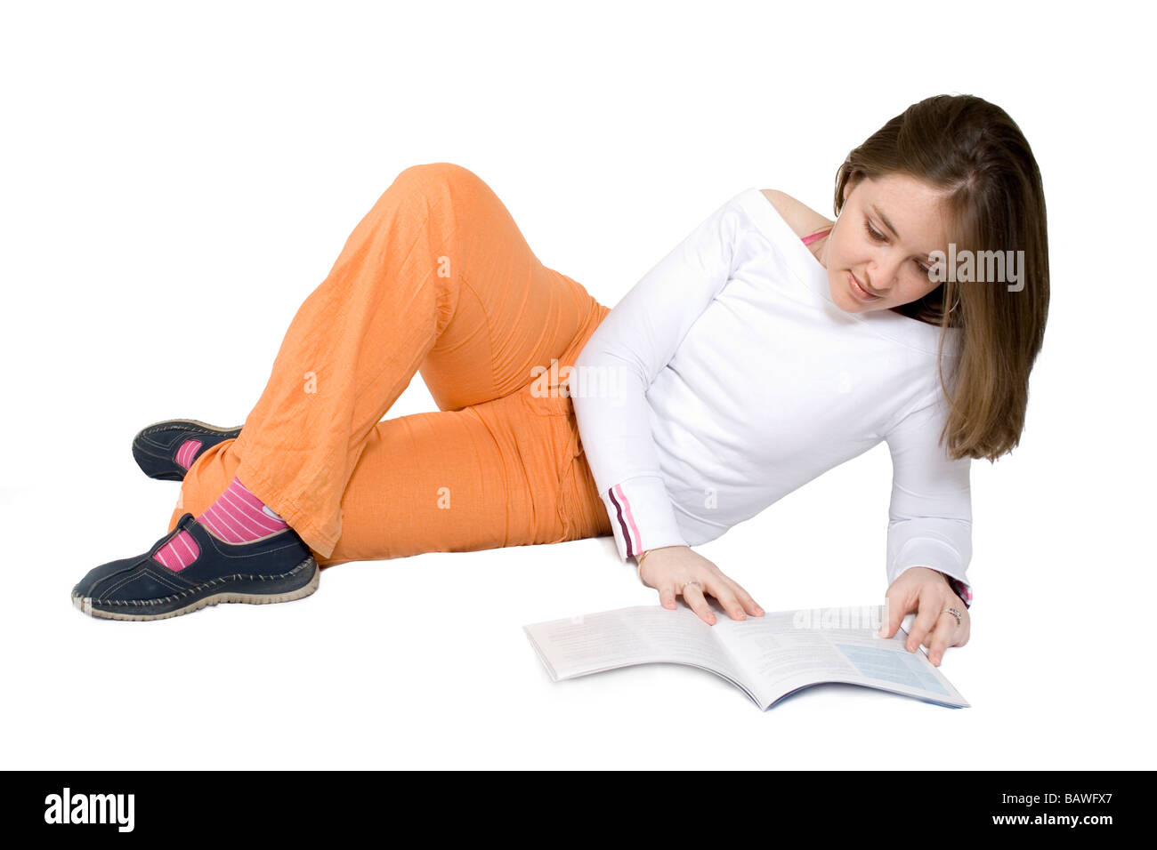 beautiful woman reading on the floor Stock Photo