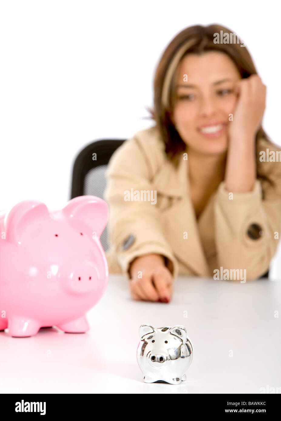 woman looking at piggybanks Stock Photo